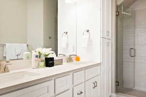 Bathroom with double vanity and walk in shower