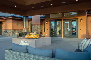 View of patio with an outdoor hangout area and ceiling fan