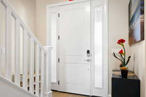 Foyer entrance featuring light hardwood / wood-style floors