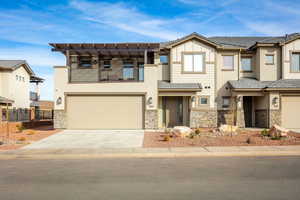 View of front of home with a balcony and a garage