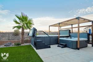 View of patio / terrace with a hot tub