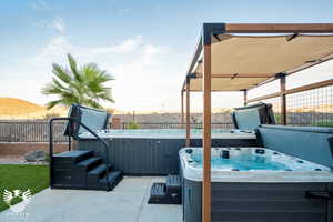 View of patio featuring a hot tub