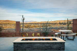 View of patio / terrace featuring a mountain view and a fire pit