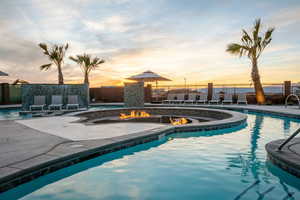 View of pool at dusk