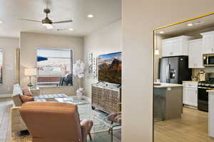 Living room featuring light hardwood / wood-style floors and ceiling fan