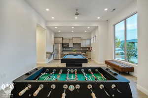 Rec room with light tile patterned flooring and billiards