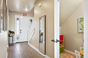 Entryway with hardwood / wood-style floors