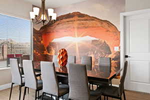 Dining room featuring a notable chandelier and light hardwood / wood-style floors