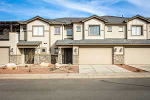 View of property with a garage