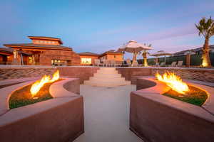 Patio terrace at dusk with an outdoor fire pit