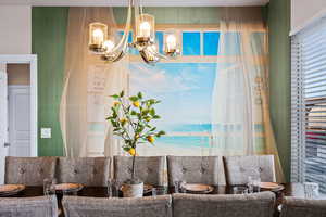 Living room with a water view and a notable chandelier