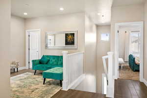 Sitting room featuring dark colored carpet