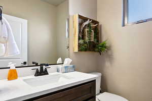 Bathroom with vanity and toilet