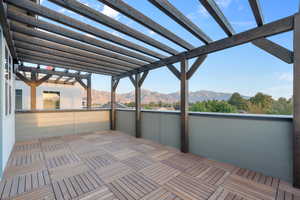 View of patio featuring a mountain view and a pergola