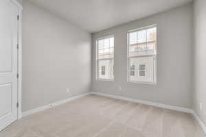 Unfurnished room with carpet flooring