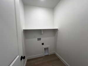 Washroom featuring hookup for an electric dryer, hookup for a washing machine, and wood-type flooring