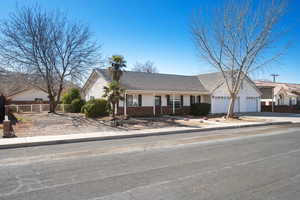 View of front facade featuring a garage