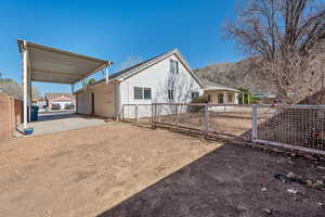 View of home's exterior featuring a mountain view and a carport