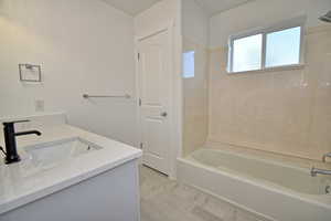 Upstairs Hall Bathroom by the Bedrooms with new LVT flooring and quartz countertops