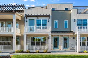 Back of house featuring a balcony