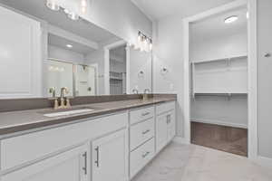 Bathroom featuring vanity and walk in shower