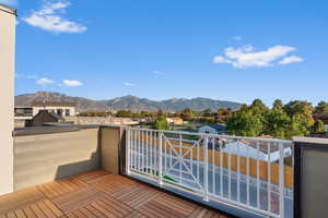 Wooden terrace featuring a mountain view