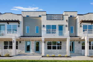 View of front of house with a balcony