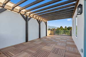 View of patio / terrace featuring a balcony, a mountain view, and a pergola