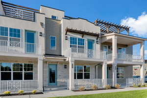 View of rear of property featuring a balcony