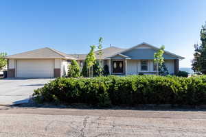 Ranch-style house featuring a garage