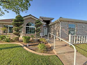 View of front of house featuring a front lawn