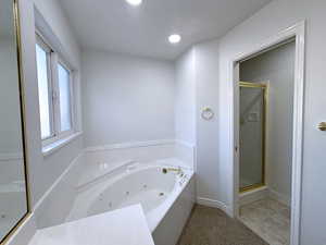 Bathroom featuring plus walk in shower