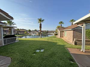 View of yard with a water view