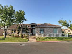 View of front of house featuring a front yard