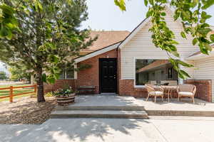 View of front of house with a patio