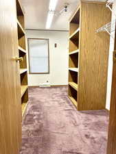 Master bedroom closet with door to master bathroom