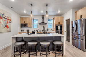 Kitchen with waterfall granite countertop