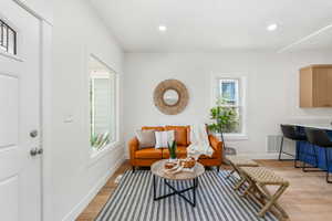 Sitting room with light wood-type flooring