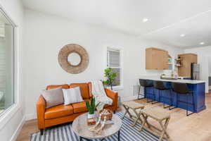 Living room featuring light hardwood / wood-style floors and sink