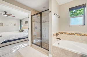 Bathroom with shower with separate bathtub, ceiling fan, and tile patterned floors