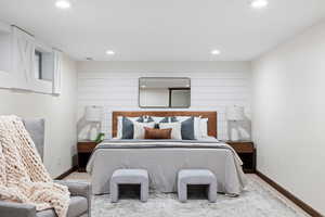 Bedroom featuring wooden walls