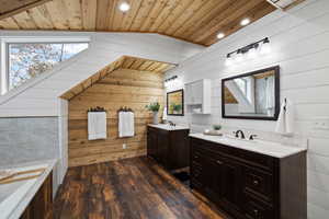 Bathroom featuring hardwood / wood-style flooring and wood walls