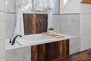 Bathroom with a relaxing tiled tub