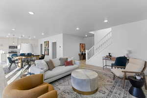 Living room with light hardwood / wood-style floors