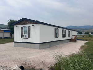 View of side of property featuring a mountain view