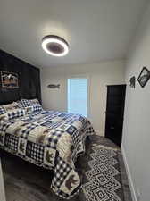 Bedroom featuring dark hardwood / wood-style floors