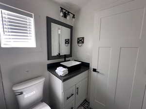 Bathroom featuring toilet and vanity