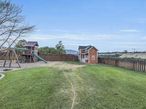 View of yard featuring a playground