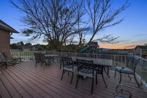 Deck at dusk with a playground