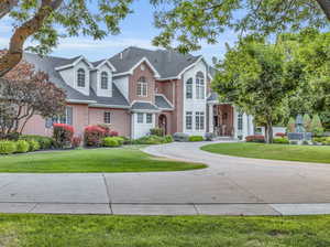 View of front of property with a front yard